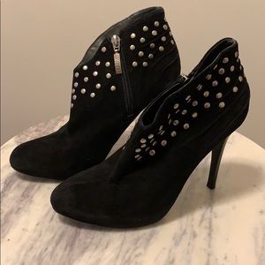Studded suede heeled booties by Guess